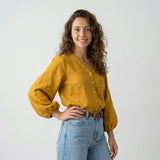 Blusa Fluida con Escote en V y Mangas Amplias Elegantes