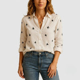 Blusa femenina de lino con corte suelto y cuello clásico