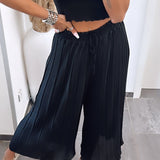 Maya | Pantalones plisados Melnas — comodidad ligera y corte elegante