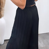 Maya | Pantalones plisados Melnas — comodidad ligera y corte elegante