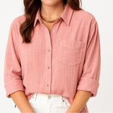 Blusa femenina de manga larga con corte suelto y bolsillo frontal