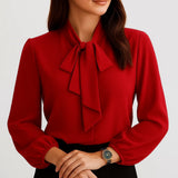 Blusa femenina elegante con lazo en el escote y manga larga
