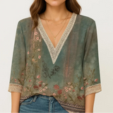 Blusa elegante con escote en V y mangas tres cuartos para mujer