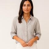 Blusa femenina de manga larga con corte suelto y bolsillo frontal
