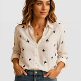 Blusa femenina de lino con corte suelto y cuello clásico