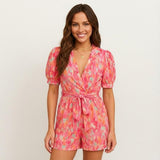 Short jumpsuit for women with V-neck and adjustable belt