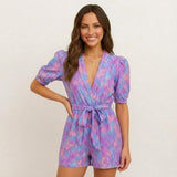 Short jumpsuit for women with V-neck and adjustable belt
