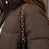 Chaqueta acolchada recortada para mujer con cremallera frontal y cuello alzado